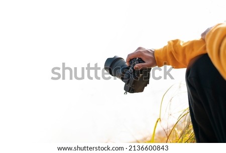 Photographer holding his camera, Photography videography concept image