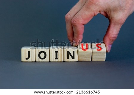 Join us symbol. Businessman turns wooden cubes and changes concept words Join to Join us. Beautiful grey background. Business support and join us concept. Copy space.