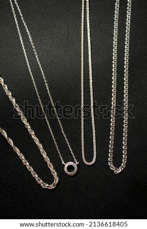 silver men's chains jewelry for men on a black background 