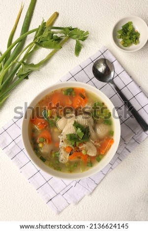 Chicken Soup with Vegetables, on white bowl.