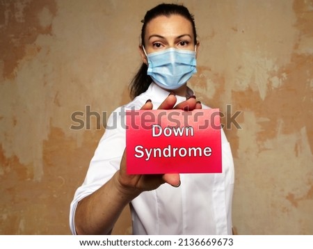 Medical concept about Down Syndrome with sign on the piece of paper.
