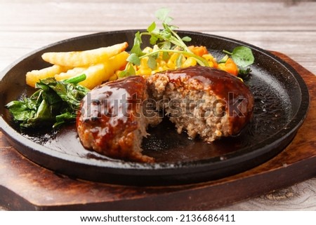 Hamburger steak set meal served on an iron plate