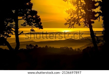 Creeping fog at dawn landscape. Beautiful sunrise. Tequila sunrise. Sky at dawn Royalty-Free Stock Photo #2136697897