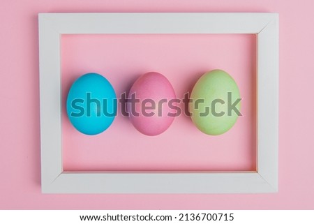 tricolor easter egg in a white frame