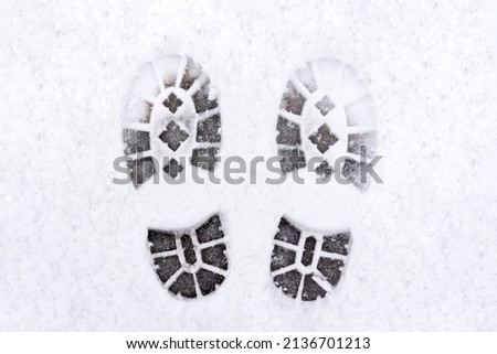 trail of shoes in the snow, tread in the snow. High quality photo