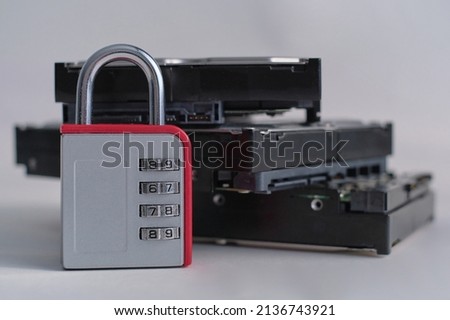 Encrypted hard disk. Padlock with cipher on an opened hard disk. Data loss. computer motherboard. the concept of data, hardware, information technology and cyber security.