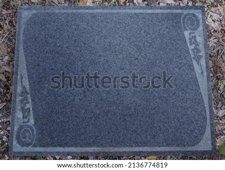 An empty headstone waiting for its epitaph. Shot of a gravestone in a cemetery.
