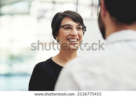 Sharing some positive news. Cropped shot of a businesswoman having a discussion with a colleague in an office. Royalty-Free Stock Photo #2136775415