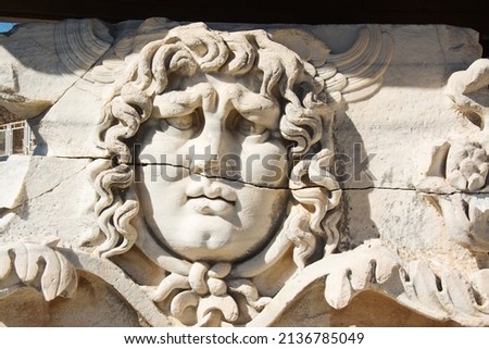Detail of  Medusa head in Apollo Temple, Didim, Turkey. Royalty-Free Stock Photo #2136785049