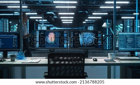 Two Digital Computer Screens with a Green Mock Up Chromakey in Modern Monitoring Office. Control Room with Specialists and Managers on the Background. High Tech Electronics Industrial Design Royalty-Free Stock Photo #2136788205