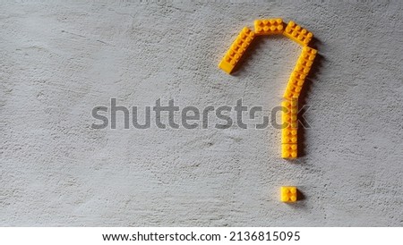 yellow question mark  design from toy puzzle