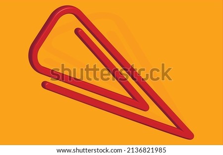 triangular red paper clip casts a shadow on a yellow background 