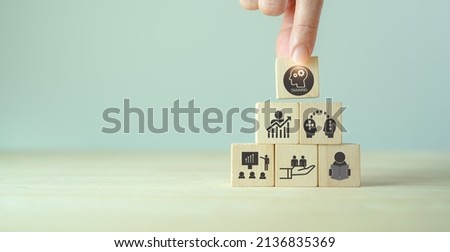 Human resource training and development concept.Business, personal development improving and enhancing competency, performance.
Putting wooden cubes training with brainstorm, coaching, learning icons.