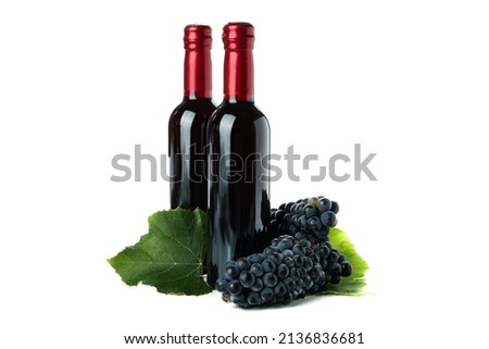 Bottles of wine and grape isolated on white background Royalty-Free Stock Photo #2136836681