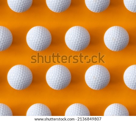 Golf ball pattern on a orange background