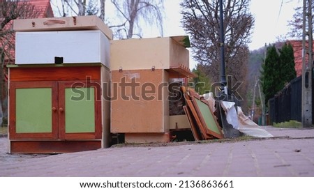 Pile of Old Furniture and Household Goods Dumped on the Street Prepared for Bulk Item Curbside Pickup Collection by City Services Royalty-Free Stock Photo #2136863661
