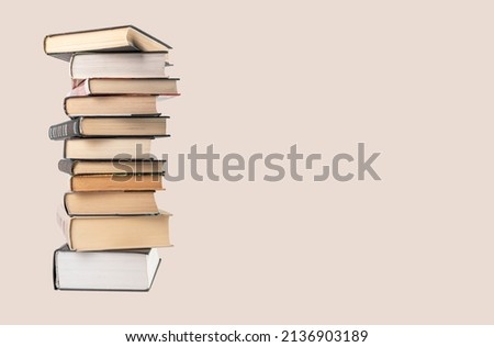 Banner with big books tower. Education, reading, information search concept. Place for text. High quality photo