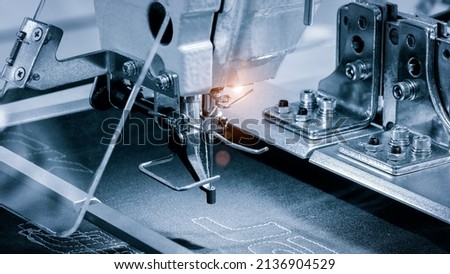 Sewing equipment, loom equipment at a garment factory, industrial concept background Royalty-Free Stock Photo #2136904529