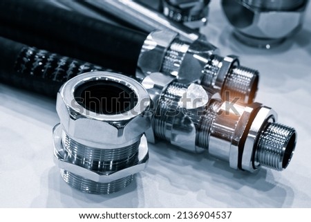 Rubber hoses and tubes with metal fasteners, industrial concept background Royalty-Free Stock Photo #2136904537