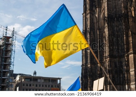 flags and symbols at a peaceful protest in defense of Ukraine