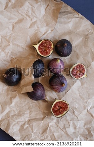Juicy figs cut on craft paper 