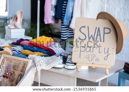 Swap Party invitation poster with stylized lettering and style decoration. Event for exchange of clothes, shoes and accessories. Reduce and reuse concept. Idea of exchange your old wardrobe for new Royalty-Free Stock Photo #2136931865