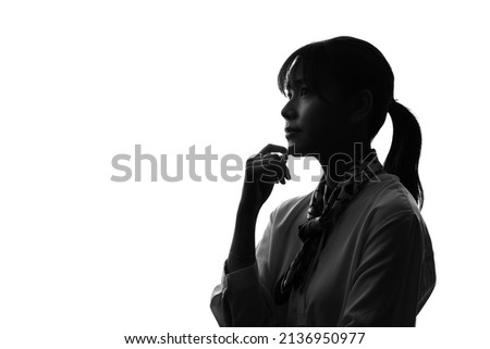 Silhouette of young asian woman. Royalty-Free Stock Photo #2136950977