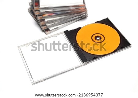 Close-Up Of Compact Discs Over White Background