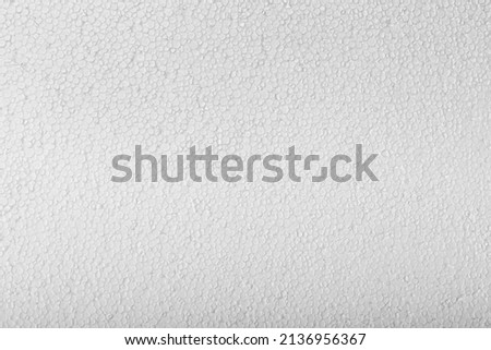Abstract close up texture photo of compressed white styrofoam background. Royalty-Free Stock Photo #2136956367