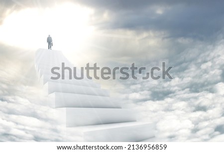 Stairway to heaven. Shot of a man on a stairway leading up to heaven.