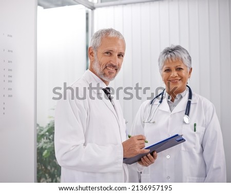 Consulting a colleague for a second opinion. Shot of two doctors working together in a hospital. Royalty-Free Stock Photo #2136957195