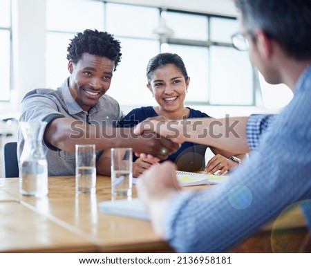 Im impressed. Shot of two businessmen shaking hands in a meeting.