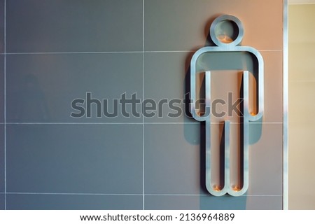 toilet symbol man and woman metal icon and white background