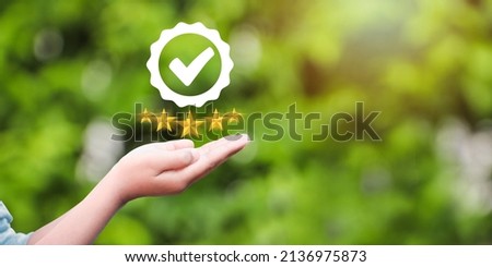 Hand shows the sign of the top service Quality, Guarantee, Standards, ISO certification and standardization concept. Royalty-Free Stock Photo #2136975873