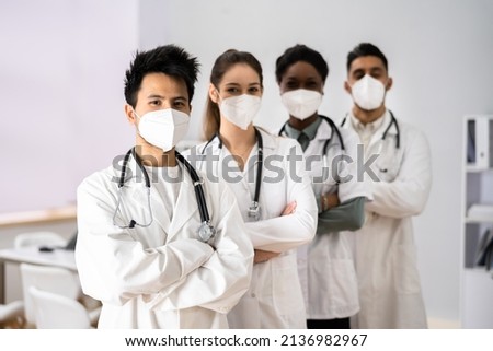Medical Healthcare Doctor Group In Hospital Wearing FFP2 Face Mask