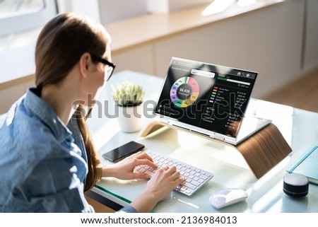 Woman Tracking Budget Using Fintech App On Computer Royalty-Free Stock Photo #2136984013