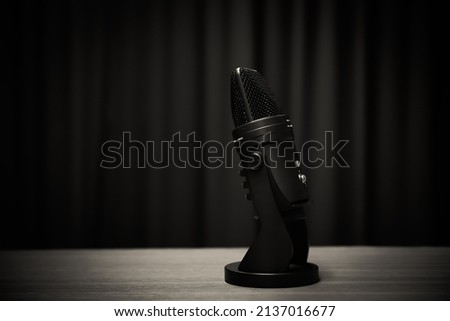 Close-up podcasting microphone on table equipment for sound studio record producer and audio editor or speaker speech presentation or talk and talking on live the media content concept.