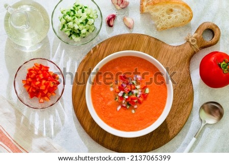 Gazpacho soup. Traditional spanish cold tomato soup of fresh raw vegetables, top view. Royalty-Free Stock Photo #2137065399