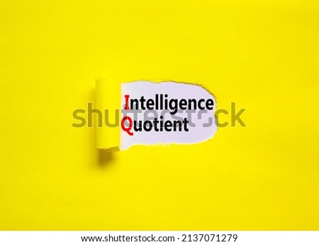 IQ intelligence quotient symbol. Concept words IQ intelligence quotient on yellow paper on a beautiful yellow table white background. Business IQ intelligence quotient concept, copy space.