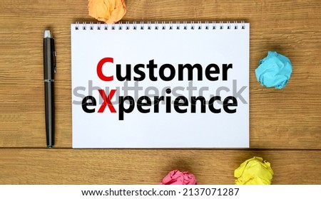 CX customer experience symbol. Concept words CX customer experience on white note. Metallic pen. Beautiful wooden background. Copy space. Business and CX customer experience concept.