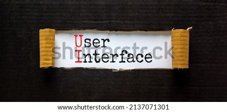 UI user interface symbol. Concept words UI user interface on white paper. Beautiful black background. Copy space. Business and UI user interface concept. Royalty-Free Stock Photo #2137071301