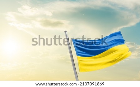 Ukraine flag on beautiful sky background