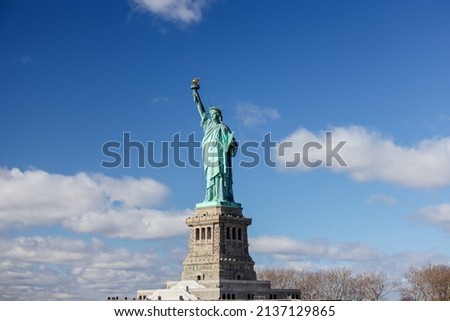 The Statue of Liberty in New York against a blue sky