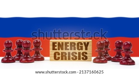 National concept. Against the background of the flag of Russia, pawns and a sign with the inscription - energy crisis