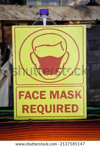 Front view of face mask required sign 