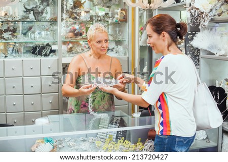 Women is shopping in a accessories boutique