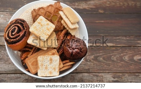 Pastries bowl on a wooden backdrop template