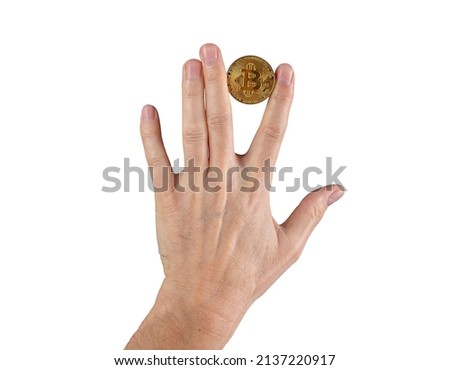 Woman hand holding bitcoin coin between fingers isolated on white background. Cryptocurrency, digital money concept. High quality photo