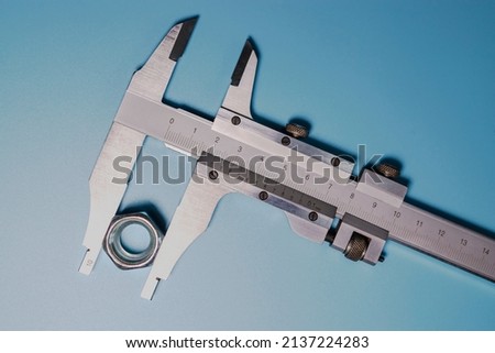 Caliper is a highly accurate measurement tool. The exact size of the parts. Professional tool Royalty-Free Stock Photo #2137224283