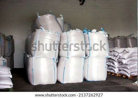 Abstract agrarian image with bags of grain in the agricultural sector in the farm. (good harvest, abundance - concept) Royalty-Free Stock Photo #2137262927